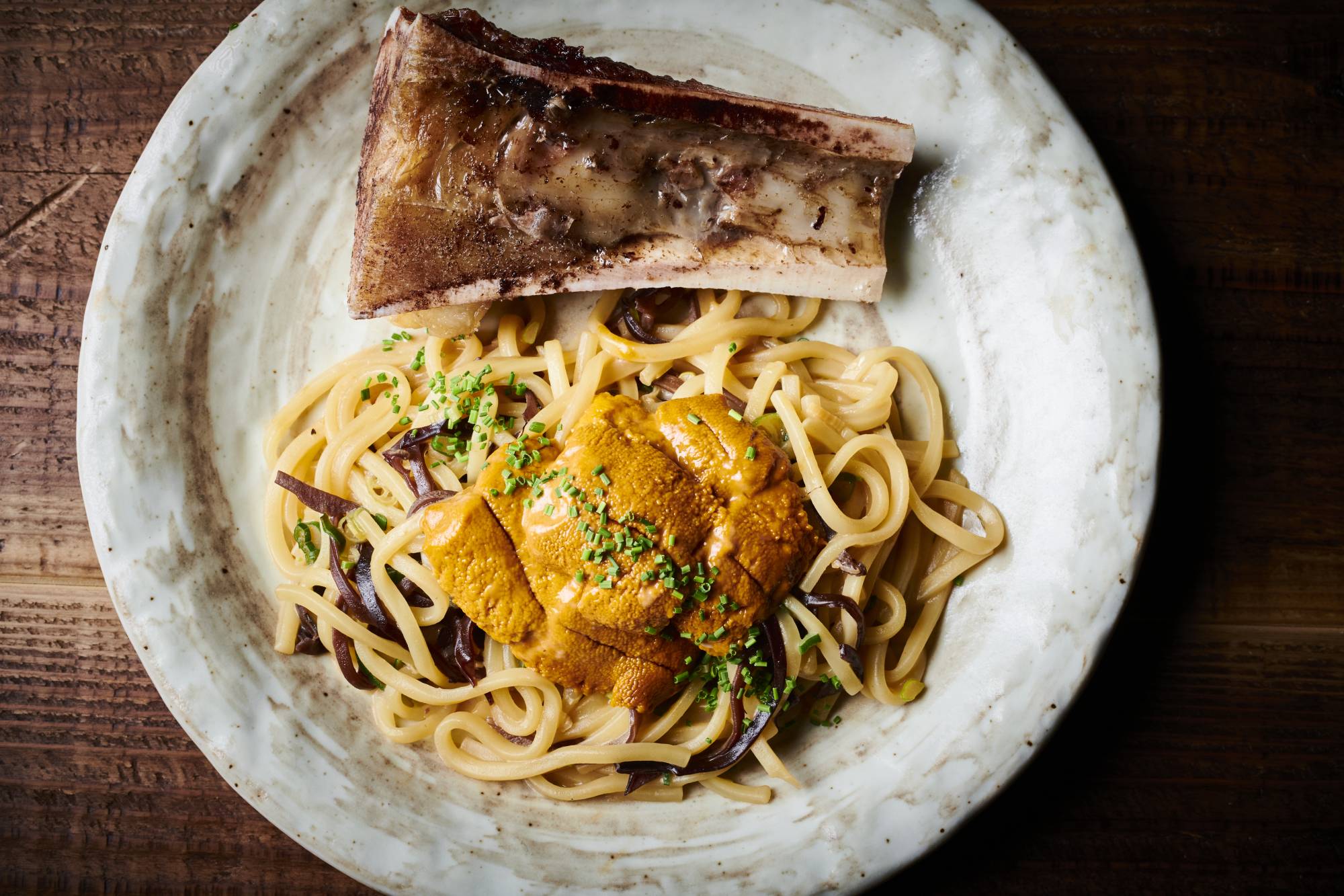 Double dose: Sea urchin and roasted bone marrow both add an umami oomph to SG Low’s mazemen noodles. | Courtesy of SG Low 