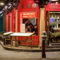 People eat at a restaurant in London\'s Chinatown on Dec. 5. | REUTERS