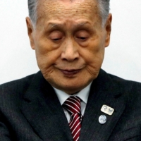 Yoshiro Mori, president of the Tokyo Organizing Committee of the Olympic and Paralympic Games, holds a news conference in Tokyo in March 2020. | REUTERS