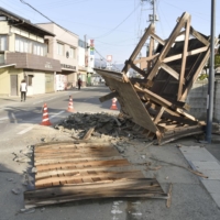 The fallen gate of a house in Koori, Fukushima Prefecture. | KYODO