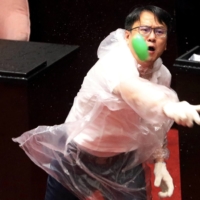 Lawmakers from Taiwan\'s Democratic Progressive Party and the Kuomintang throw water balloons at each other inside the parliament in Taipei last July. | REUTERS