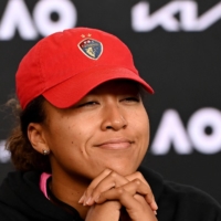 Naomi Osaka participates in a news conference after her Australian Open round-of-16 win on Sunday in Melbourne. | AFP PHOTO / VINCE CALIGIURI / TENNIS AUSTRALIA