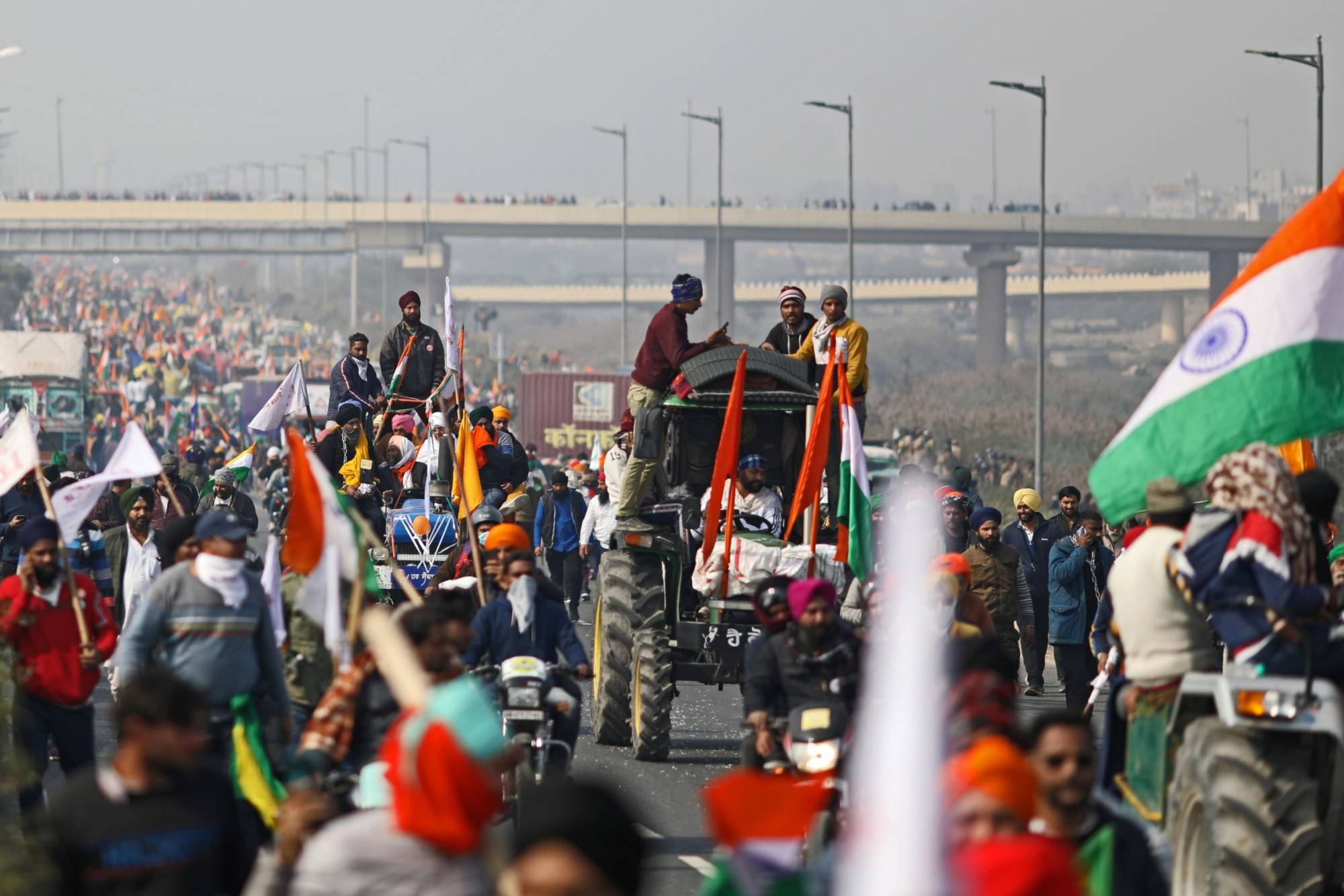 A tractor rally in support of protests in New Delhi on Jan. 26 turned violent when farmers and their supporters clashed with police and stormed city landmarks.  | BLOOMBERG 
