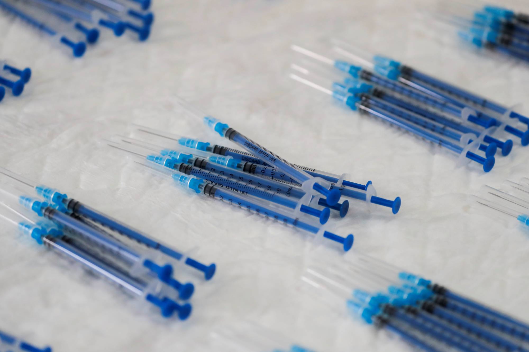 Japan is scrambling to secure special syringes that can draw six shots of the Pfizer-BioNTech COVID-19 vaccine shots from each vial. | REUTERS
