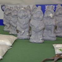 Ceramic figures used to smuggle illegal drugs into Japan are displayed at a Tokyo Customs office on Tuesday. | KYODO