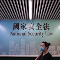 A poster for the National Security Law in Hong Kong. China has said it will \"no longer recognize\" the British National (Overseas) passport for Hong Kongers. | AFP-JIJI