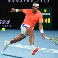 Rafael Nadal hits a return against Stefanos Tsitsipas during the quarterfinals of the Australian Open in Melbourne on Wednesday. | AFP-JIJI