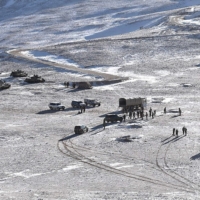 People\'s Liberation Army soldiers and tanks carry out military disengagement along the Line of Actual Control at the India-China border in Ladakh in an undated handout photograph released Tuesday. | INDIAN MINISTRY OF DEFENCE / VIA AFP-JIJI