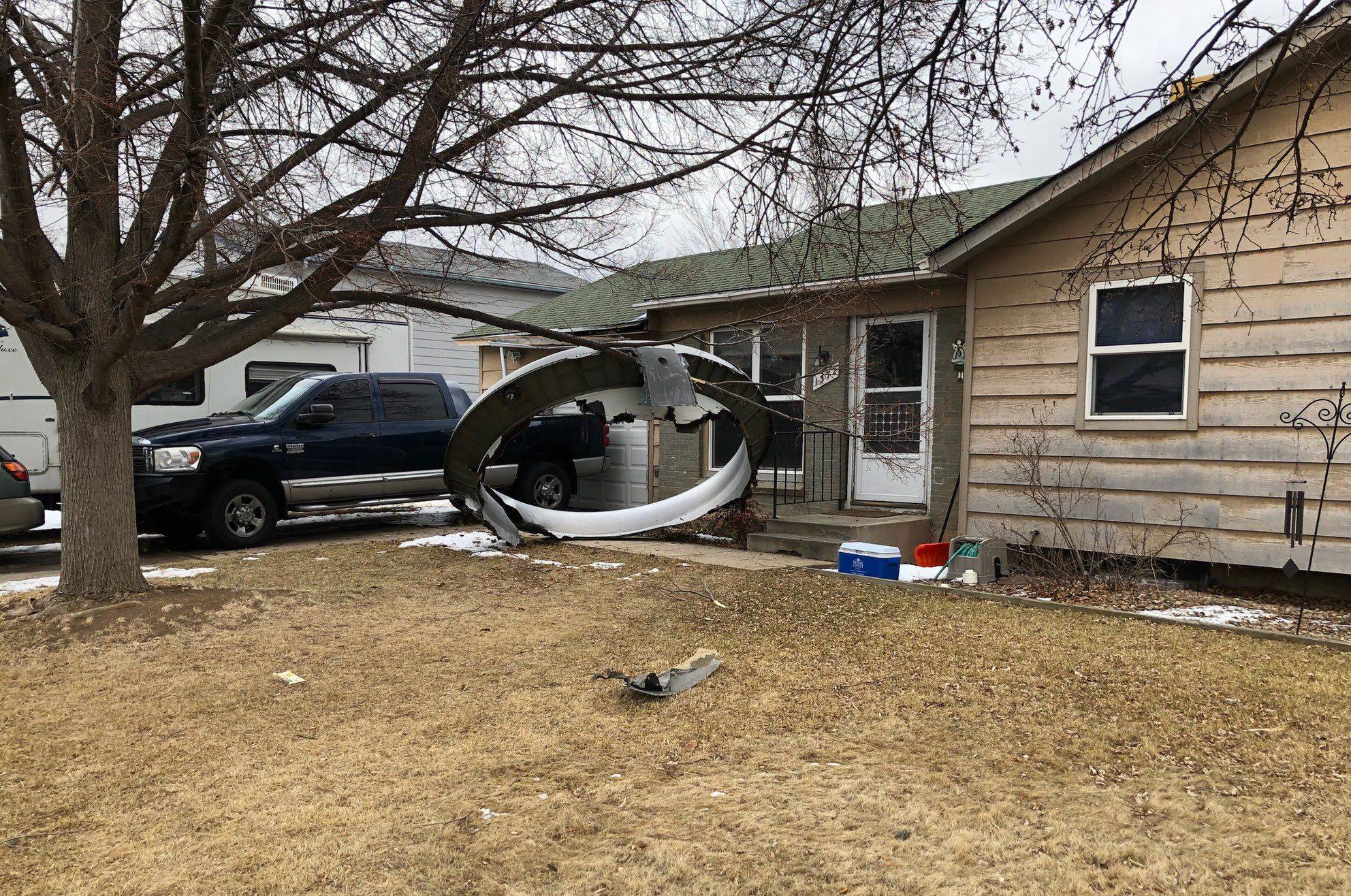 Engine debris from a United Airlines airplane's engine in the neighborhood of Broomfield, outside Denver, on Saturday | BROOMFIELD POLICE DEPARTMENT / VIA AFP-JIJI