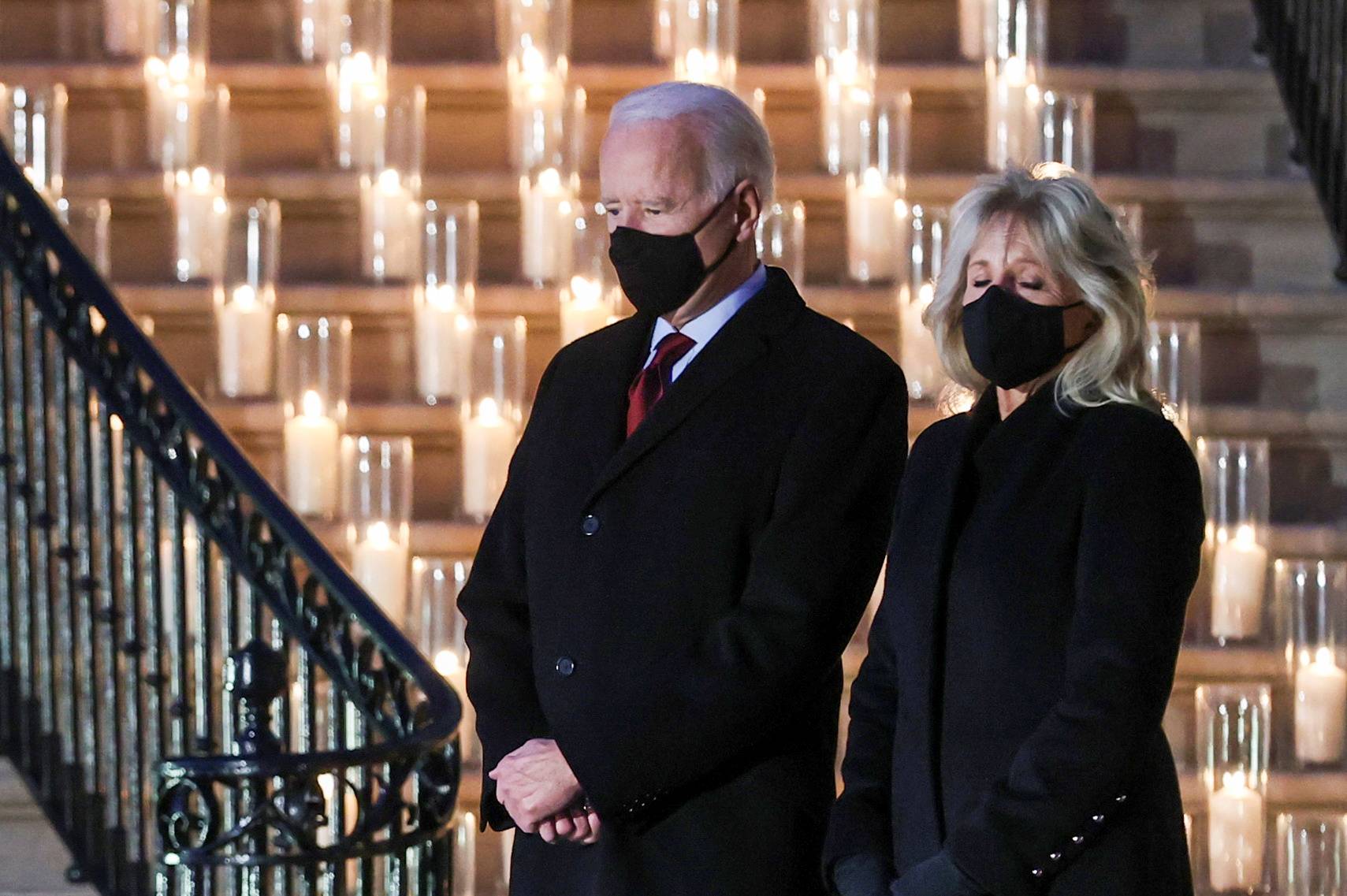 U.S. President Joe Biden and his wife, Jill Biden, pause for a moment of silence at the White House on Monday to mark the grim milestone of 500,000 U.S. deaths from COVID-19. | REUTERS 