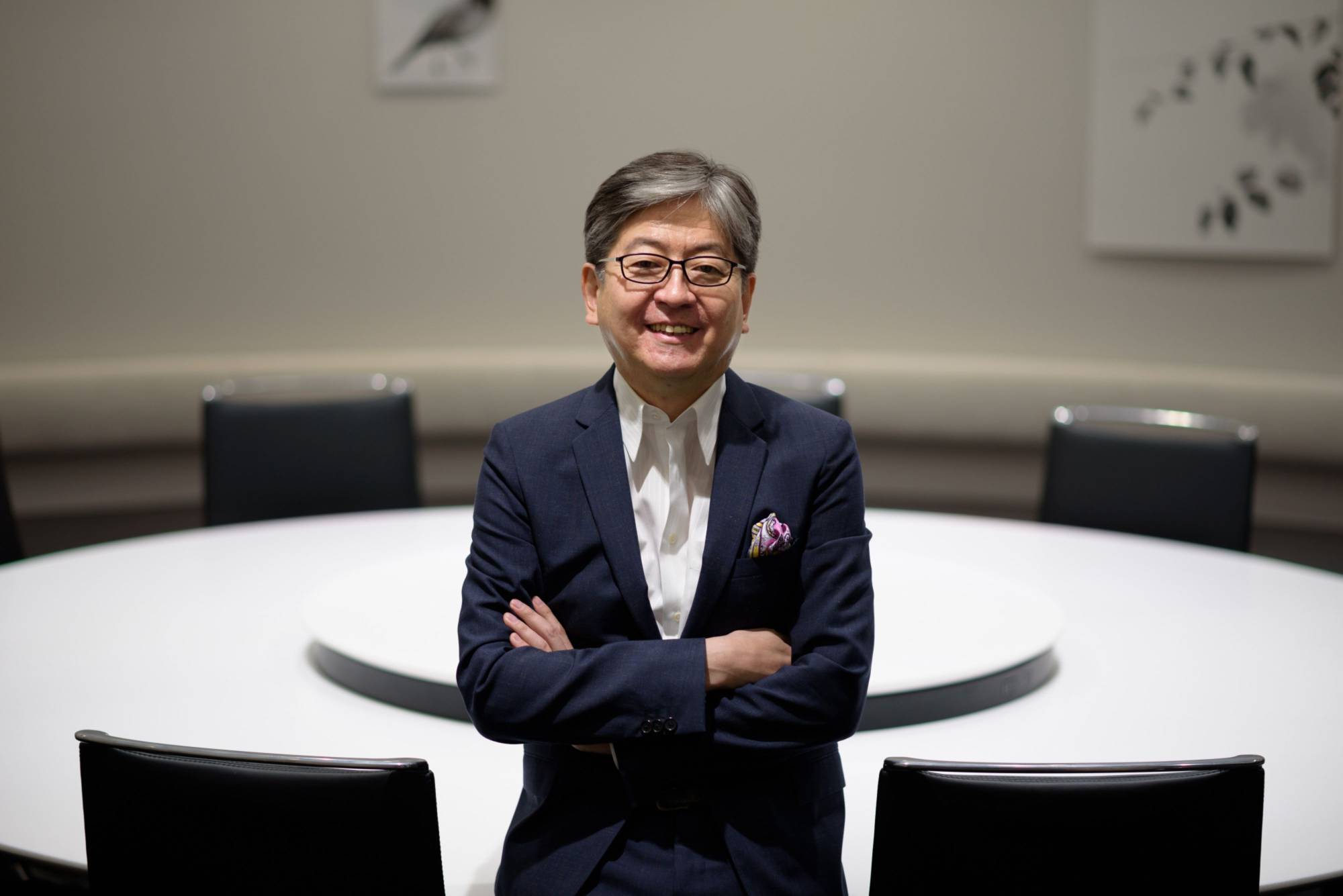Oki Matsumoto, chief executive officer of Monex Group Inc., poses for a photograph in Tokyo in May 2018. Monex has been diversifying into cryptocurrency as intensifying competition dims prospects of its mainstay stock brokerage business. | BLOOMBERG