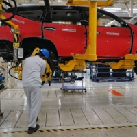 An employee works on a production line at Mitsubishi Motors Corp.\'s plant in Cikarang, Indonesia, in April 2017. The firm has been focusing on Southeast Asia, but may reverse its decision to pull back from Europe. | BLOOMBERG