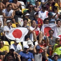 Fans cheer during a match between Kei Nishikori and Britain\'s Andy Murray at the Rio Olympics on Aug. 13, 2016, in Rio de Janiero. | REUTERS