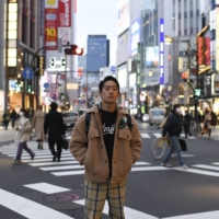 Kaisei Sugawara, an engineer at one of Japan’s largest security companies, in Tokyo\'s Shinjuku district, on Friday. Some young workers say they are seeing signs of cracks in Japan\'s rigid culture of seniority, even in more traditional companies; Sugawara expects to be posted abroad by his fourth year, far earlier than in previous generations. 

 | NORIKO HAYASHI/THE NEW YORK TIMES
