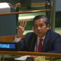 Kyaw Moe Tun, Myanmar\'s ambassador to the U.N., makes a three-finger salute as he addresses an informal meeting of the General Assembly on Friday in New York.  | YOUTUBE / UNITED NATIONS / VIA AFP-JIJI
