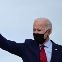 U.S. President Joe Biden waves as he departs Washington for a trip to Delaware, at Joint Base Andrews in Maryland on Saturday. | REUTERS