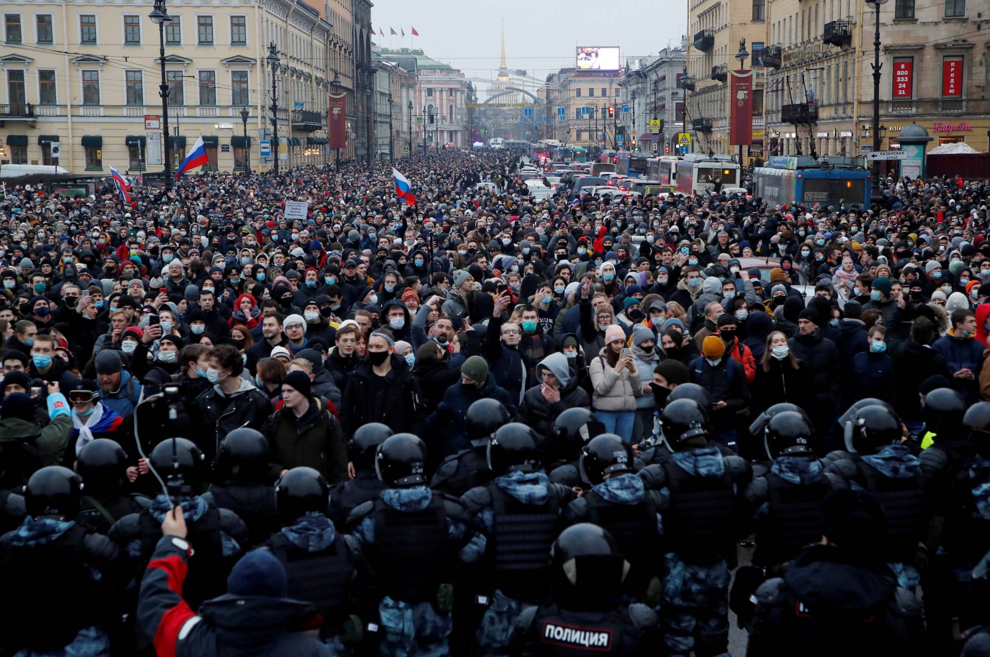 Law enforcement officers stand in front of participants during a rally in support of jailed Russian opposition leader Alexei Navalny in Saint Petersburg on Jan. 23. | REUTERS