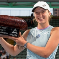 Iga Swiatek poses with the winner\'s trophy after defeating Belinda Bencic in the women\'s singles final at the Adelaide International on Saturday in Adelaide, Australia. | AFP-JIJI