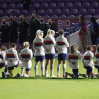 Members of the United States women\'s team team kneel during the national anthem before a SheBelieves Cup match against Canada on Feb. 18 in Orlando, Florida. | USA TODAY / VIA REUTERS