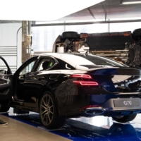 A customer looks at a Hyundai Motor Co. Genesis G70 sedan at the company\'s Motorstudio showroom in Seoul. | BLOOMBERG 