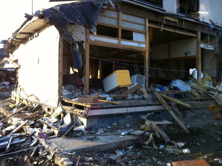 Some volunteers worked clearing mud brought by the tsunami from houses, and helping residents to locate important belongings and keepsakes. | JAMIE EL-BANNA