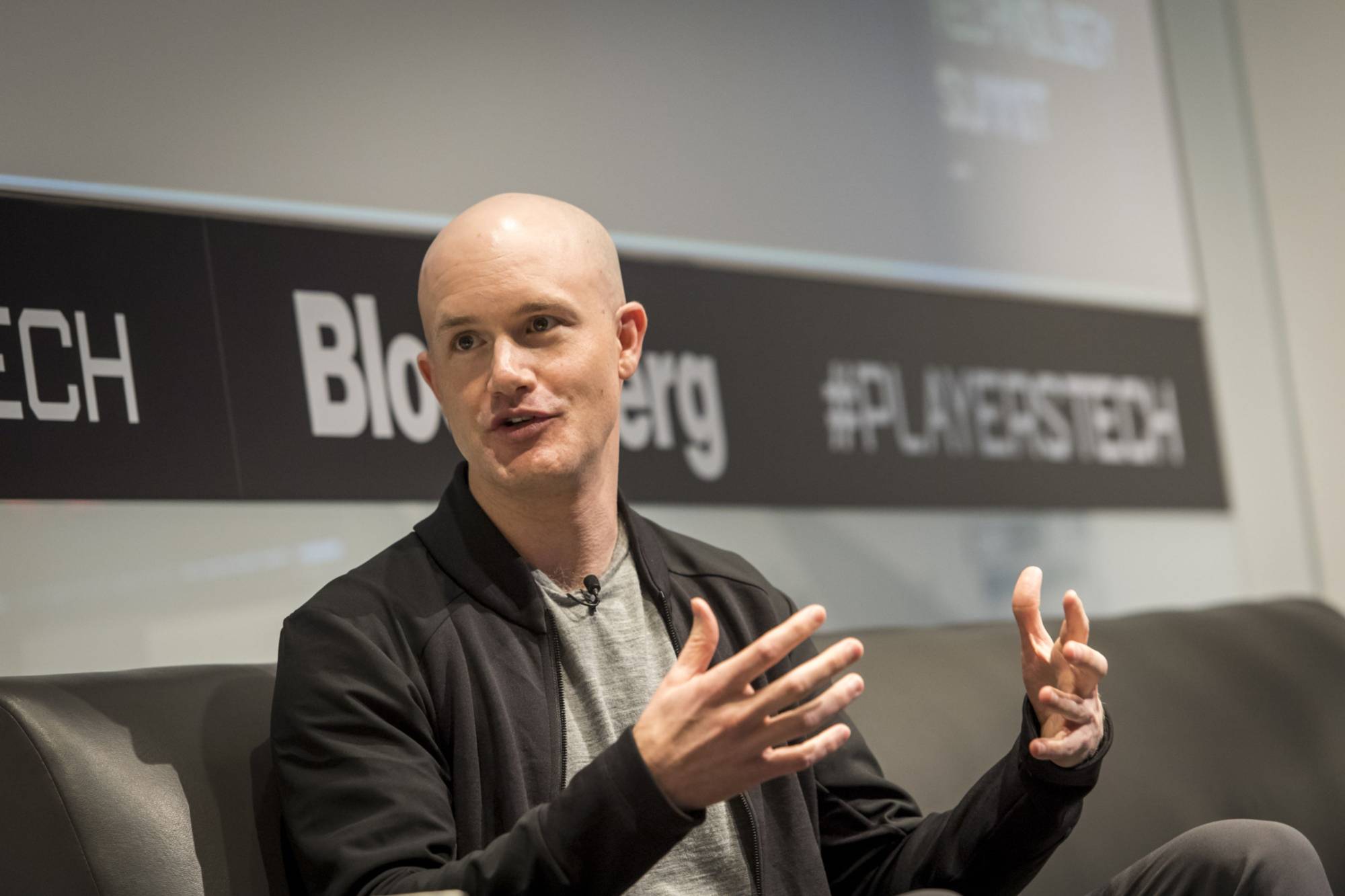 Brian Armstrong, co-founder and chief executive officer of Coinbase Inc., speaks during the Players Technology Summit in San Francisco on Aug. 14, 2018. | BLOOMBERG
