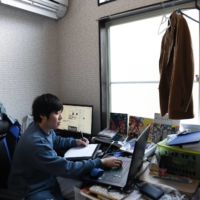 Tetsuya Akutsu, a freelance animator, at work in his apartment in Tokyo on Jan. 14. Akutsu wants to start a family, but on his wages, he says, \"it’s impossible to get married and to raise a child.\" | NORIKO HAYASHI/THE NEW YORK TIMES