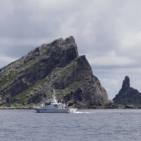 A Japan Coast Guard patrol ship sails around the Senkaku Islands in the East China Sea. China on Monday urged Japan not to take \"dangerous actions that may complicate\" the situation surrounding the islets. | REUTERS