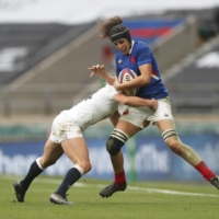 France’s Cyrielle Banet is tackled by England’s Abbie Ward during a match in London on Nov. 21, 2020. | REUTERS