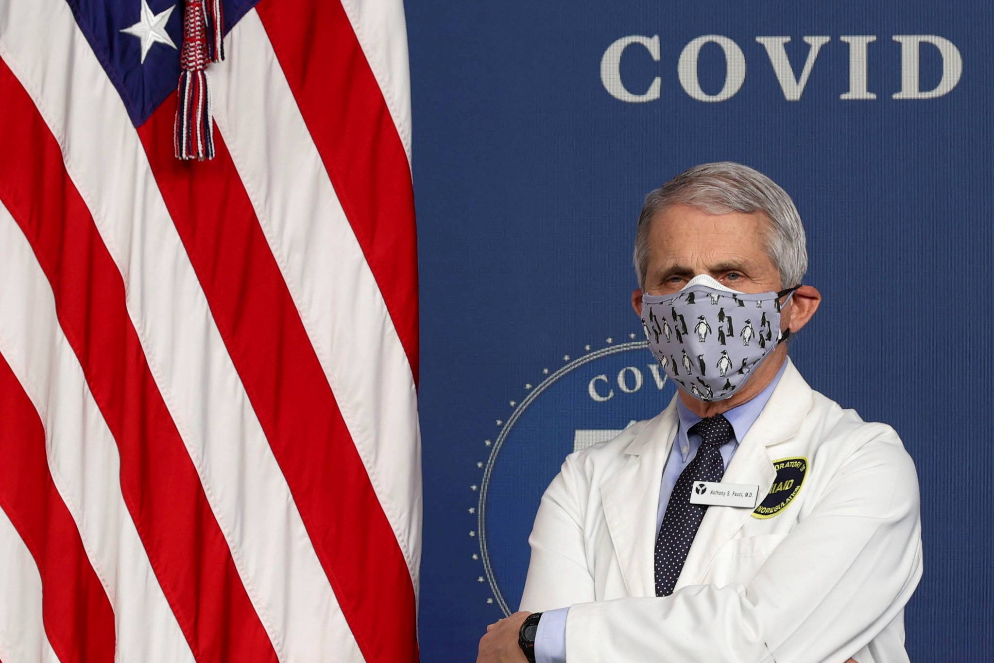 National Institute of Allergy and Infectious Diseases Director Dr. Anthony Fauci stands by during an event to mark the milestone of 50 million COVID-19 vaccine doses being administered in the U.S., during an event at the White House on Feb. 25. | Reuters 