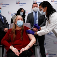 A nurse administers the Johnson & Johnson COVID-19 vaccine at Northwell Health\'s South Shore University Hospital in Bay Shore, New York, on Wednesday.  | REUTERS 