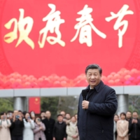 Chinese President Xi Jinping meets with local residents in the Guanshanhu District of Guiyang, the capital of southwest China\'s Guizhou Province, on Feb. 4. | XINHUA /GETTY IMAGES / VIA BLOOMBERG 