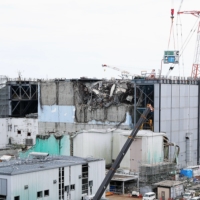 Tokyo Electric Power Co. discloses its debris clearing work to the press at the Fukushima Daiichi nuclear power plant\'s No. 3 reactor on Sept. 4, 2015, ahead of the four and a half year mark of the 2011 disaster. | KYODO