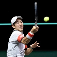 Kei Nishikori hits a return against Borna Coric during their quarterfinal match at the ABN AMRO World Tennis Tournament on Friday in Rotterdam, Netherlands. | REUTERS