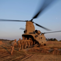 Members of South Korea and U.S. Special forces board a CH-47 Chinook helicopter during a joint military exercise in Gangwon province, South Korea, in November 2019.  | U.S. AIR FORCE / VIA REUTERS