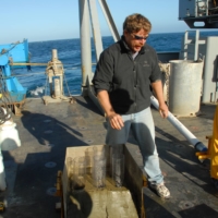 Marine geologist Chris Goldfinger conducts research on a vessel off the coast of Oregon. | COURTESY OF CHRIS GOLDFINGER 
