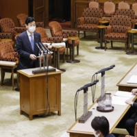 Yasutoshi Nishimura, minister in charge of the country\'s COVID-19 response, has apologized for allowing his staff to work excessive overtime hours while dealing with the pandemic. | KYODO