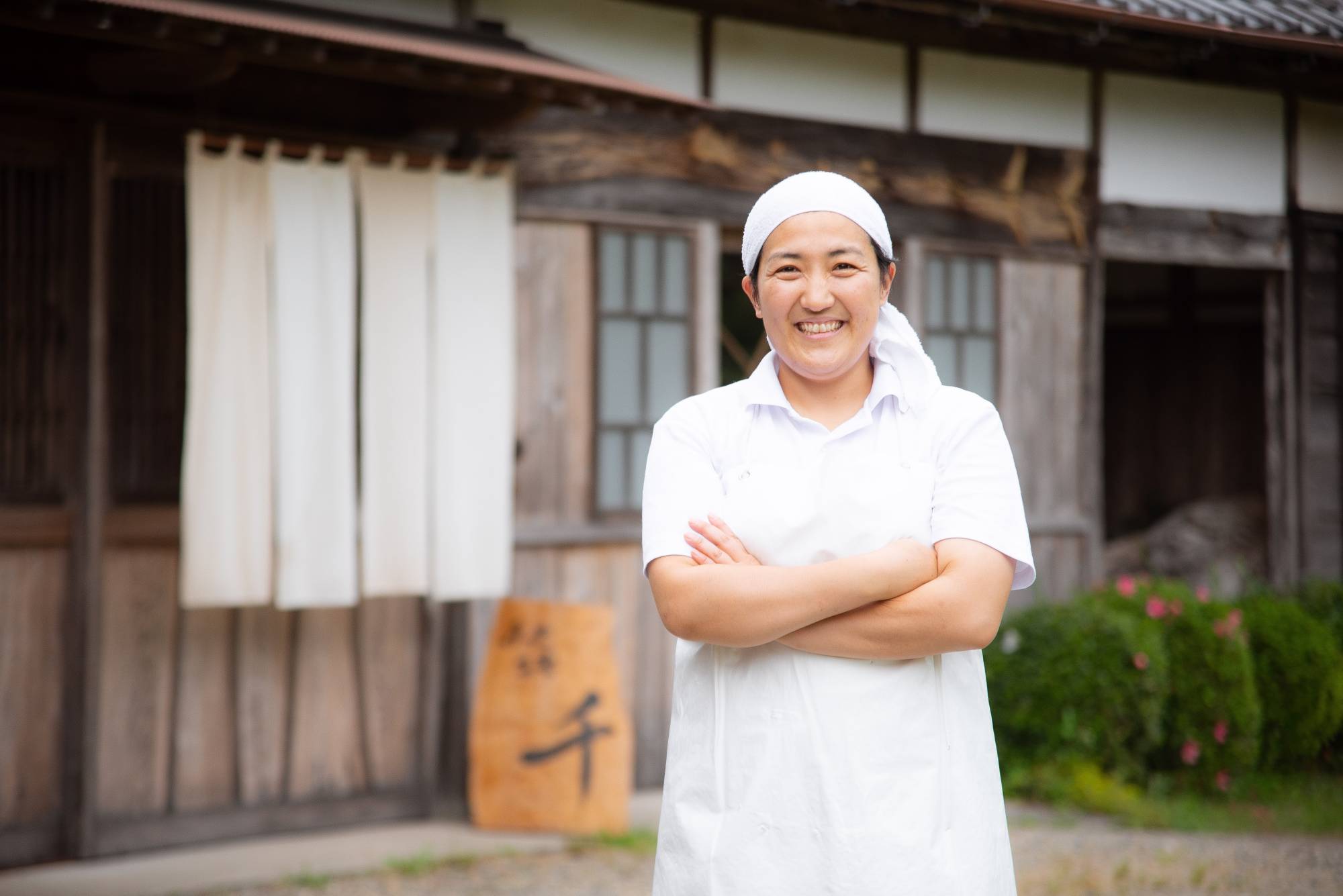 A unique taste: Chiyo Shibata stands in front of Fromage Sen, her cheesery in Chiba Prefecture.  | COURTESY OF FROMAGE SEN