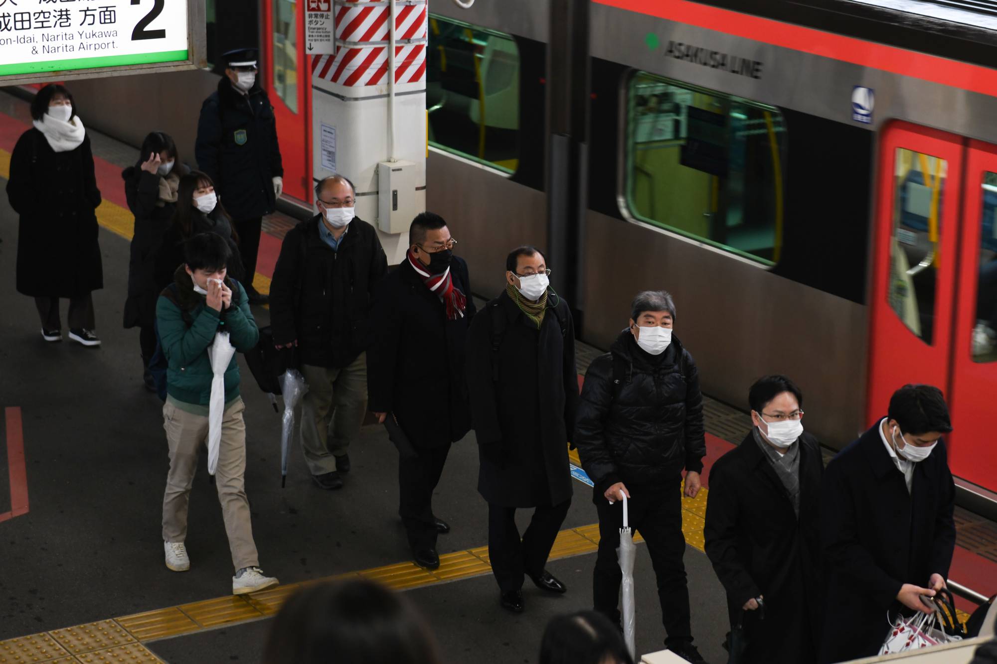 Japan's economy expanded at a pace slower than that initially reported in the October-December period. | BLOOMBERG