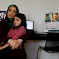 Nursiman Abdurasit with her daughter, Zehra, at her home in Istanbul on Monday | REUTERS 