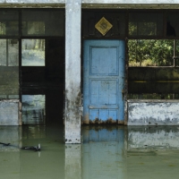 A warehouse sits abandoned after subsidence left it permanently flooded on in Jakarta. | GETTY IMAGES / VIA BLOOMBERG 