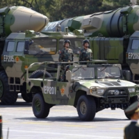 Military vehicles carrying DF-21D ballistic missiles move toward Tiananmen Square in Beijing during a military parade marking the 70th anniversary of the end of World War II in September 2015. | REUTERS