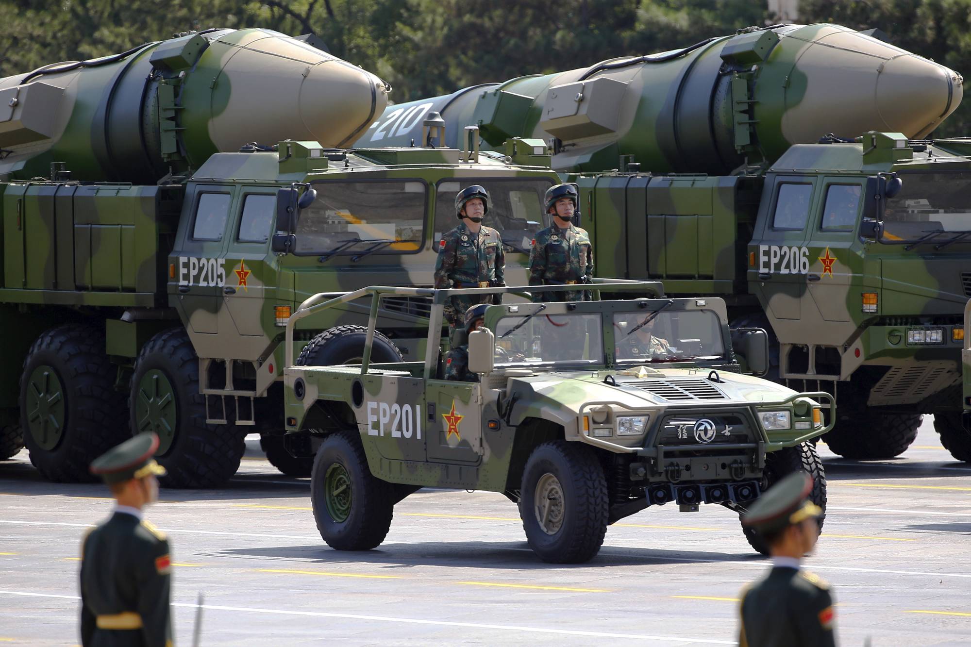Military vehicles carrying DF-21D ballistic missiles move toward Tiananmen Square in Beijing during a military parade marking the 70th anniversary of the end of World War II in September 2015. | REUTERS