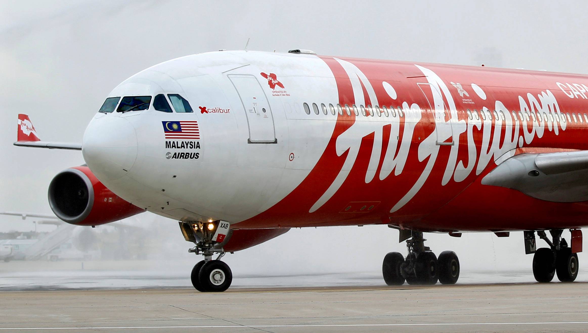 Crunched by border restrictions in Southeast Asia, low-cost airline AirAsia Group Bhd. is front loading its revenue recovery by selling 599-ringgit ($146) travel passes that allow unlimited flights in Malaysia and the ASEAN region for a year. | REUTERS