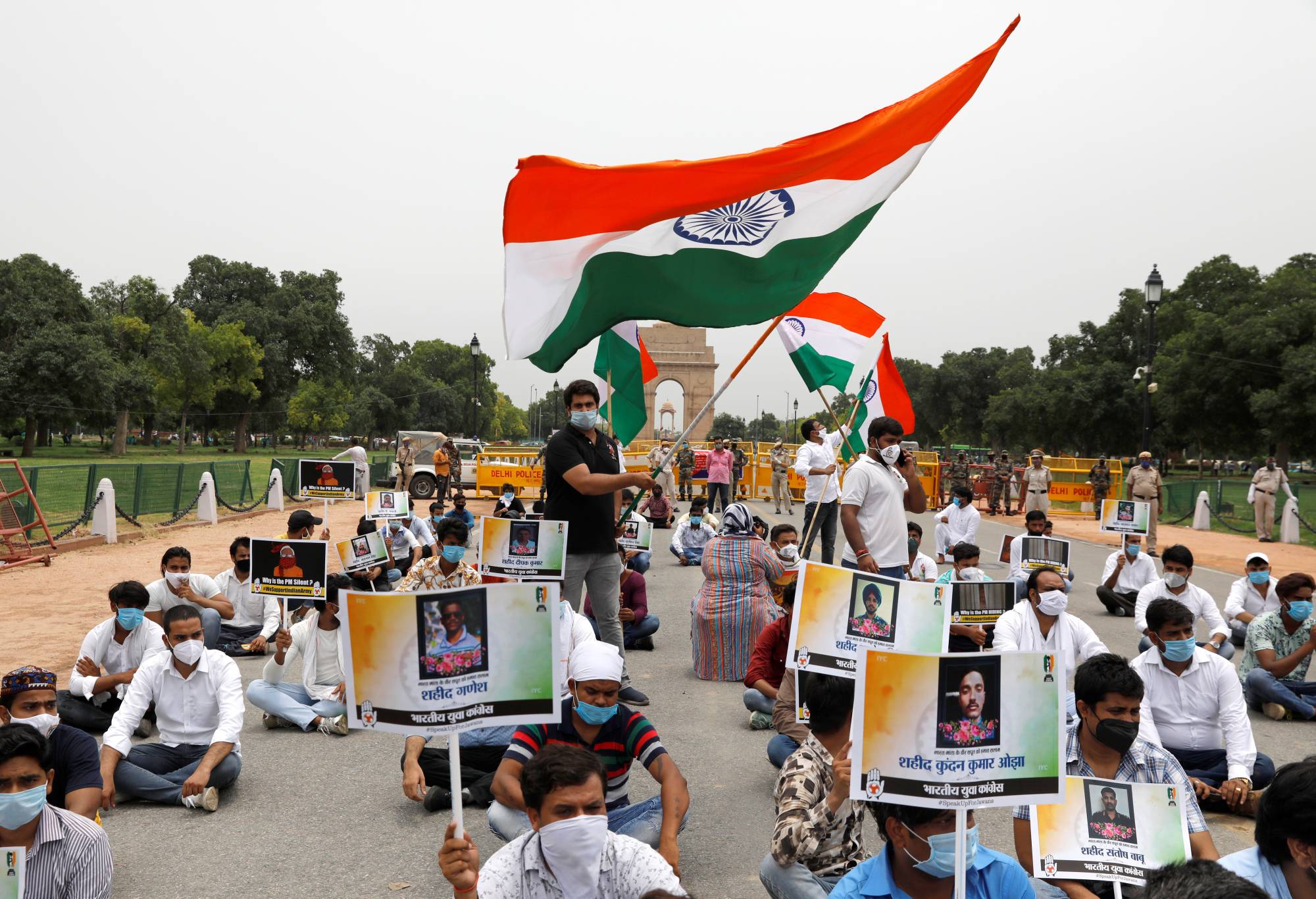 Protesters pay tribute to the Indian Army soldiers killed in a border clash with Chinese troops in the Ladakh region, during a rally in New Delhi in June. | REUTERS
