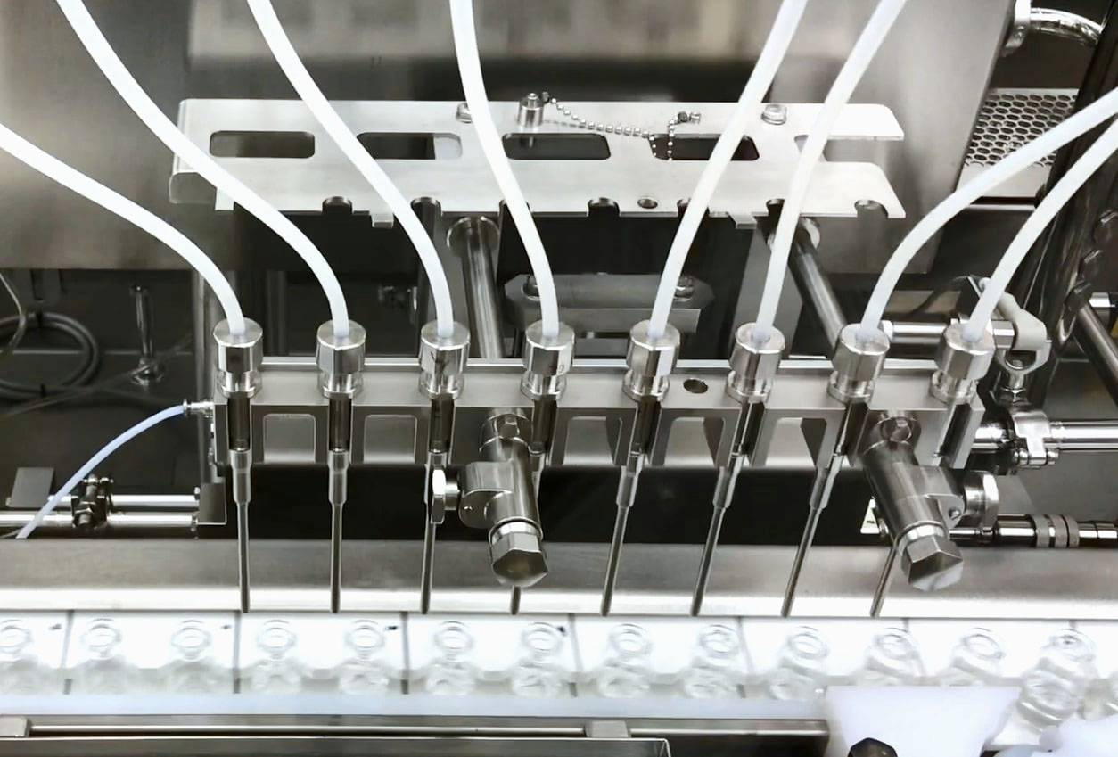 Vials are filled with AstraZeneca PLC's COVID-19 vaccine at a factory of a Daiichi Sankyo Co. subsidiary in Kitamoto, Saitama Prefecture, on Thursday. | DAIICHI SANKYO CO. / VIA KYODO