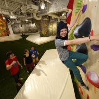 A climber scales the bouldering wall at B-Pump Ogikubo climbing gym. | COURTESY OF FRONTIER SPIRITS
