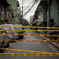 A makeshift barrier set up on a street of an area under lockdown in Manila | REUTERS