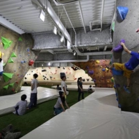 Climbers cheer each other on as they take turns on the world renowned boulders at B-Pump Ogikubo. | COURTESY OF FRONTIER SPIRITS