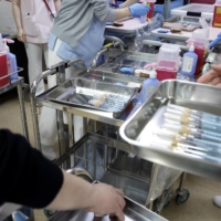 Many prefectures will begin COVID-19 vaccinations for older people amid limited supplies. | BLOOMBERG